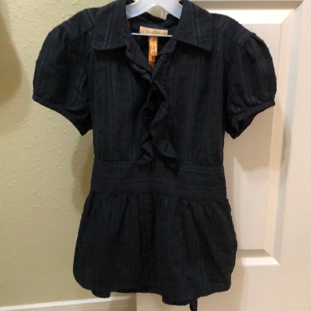 ruffled shirt with subtle silver threads.